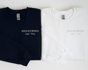 May include: Two sweatshirts, one navy blue and one white, with the text "XXVI.IX.MMXVI Lisa.Tino" printed on the front.