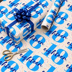 May include: Wrapping paper featuring a repeating pattern of the number 18 in bright blue and the word eighteen in dark blue script, accented with colorful confetti dots. Includes a gift box with a dark blue ribbon bow and scissors.