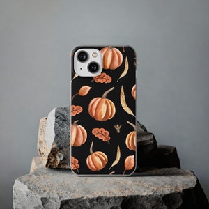 May include: A black phone case with a watercolor pattern of orange pumpkins and leaves.