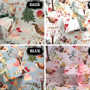May include: Four wrapped gifts with different colored wrapping paper: sage, white, blue, and pink. Each gift is decorated with a ribbon. The wrapping paper features a woodland design with animals, hearts, and floral elements.