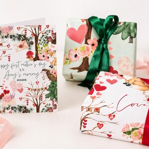 May include: A greeting card and two wrapped gifts. The card reads "Happy first mother's day as Avery's mommy 2026" with a woodland theme. The gifts are wrapped in floral and heart-themed paper, tied with green and red ribbons.