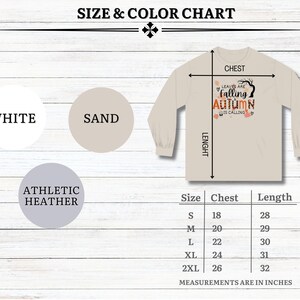May include: Size chart for a long-sleeved t-shirt with the text "Leaves are falling Autumn is calling". The shirt is available in white, sand, and athletic heather. Sizes range from S to 2XL with chest and length measurements in inches.