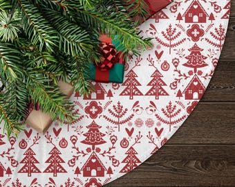 May include: Red and white Christmas tree skirt with a Scandinavian folk art design. The skirt features stylized trees, houses, and hearts.