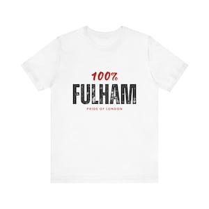 May include: White t-shirt with the text "100% FULHAM" in distressed black font, and "PRIDE OF LONDON" below. The number "100%" is in red. A casual, everyday tee.