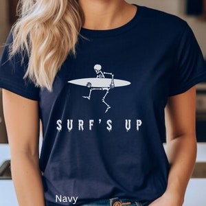 Surf&#39;s Up Skeleton Tshirt, Halloween Gift for Surfer, Funny Skeleton Shirt, Halloween Party Tshirt, Beachy Hallows Eve Surf Tee, Wave Rider