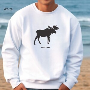 Adult unisex crewneck sweatshirt with a graphic of a moose profile above the word moose in lower case font, followed by a period. Shown in White.