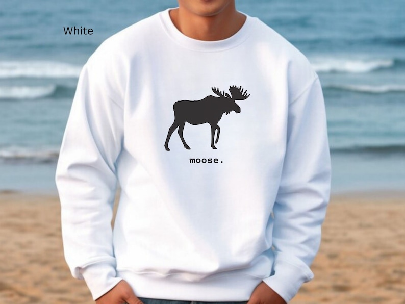 Adult unisex crewneck sweatshirt with a graphic of a moose profile above the word moose in lower case font, followed by a period. Shown in White.