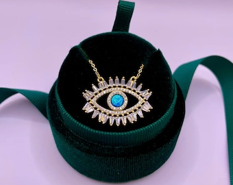 Eye necklace with captured ocean, set with white stones, nazar eye for protection. Necklace with eye, set with white crystals.