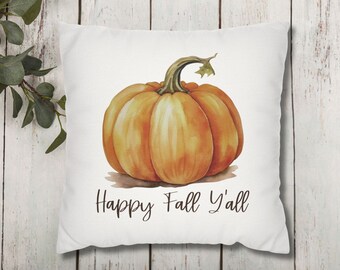 May include: White throw pillow with a watercolor illustration of an orange pumpkin and the text "Happy Fall Y'all".