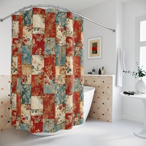 May include: A red, blue, and beige shower curtain with a patchwork design featuring floral patterns. The curtain is hanging in a bathroom with a white bathtub and a white tiled wall.