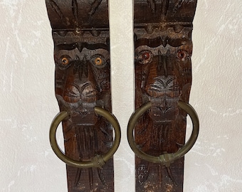 CARVED LION HEADS