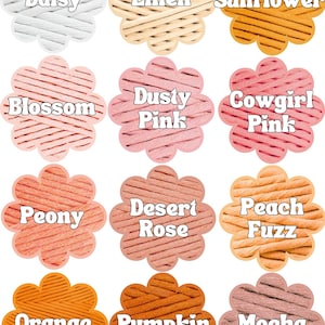 May include: A color palette featuring twelve flower-shaped swatches. Colors include Daisy, Linen, Sunflower, Blossom, Dusty Pink, Cowgirl Pink, Peony, Desert Rose, Peach Fuzz, Orange, Pumpkin, and Mocha. Each swatch displays a textured, woven material.