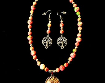 Pink Zebra Jasper beaded pendant necklace set. Silver-colored rose quartz “Tree of Life” pendant. Silvery “Tree of Life” earring dangles.