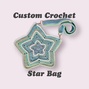 May include: A custom crochet star bag in shades of blue, green, and white. The bag has a long strap and the text "Custom Crochet Star Bag" is displayed on the image.