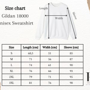 May include: Size chart for a Gildan 18000 unisex sweatshirt. The chart shows measurements in centimeters for length, width, and sleeve length for sizes S, M, L, XL, 2XL, and 3XL.