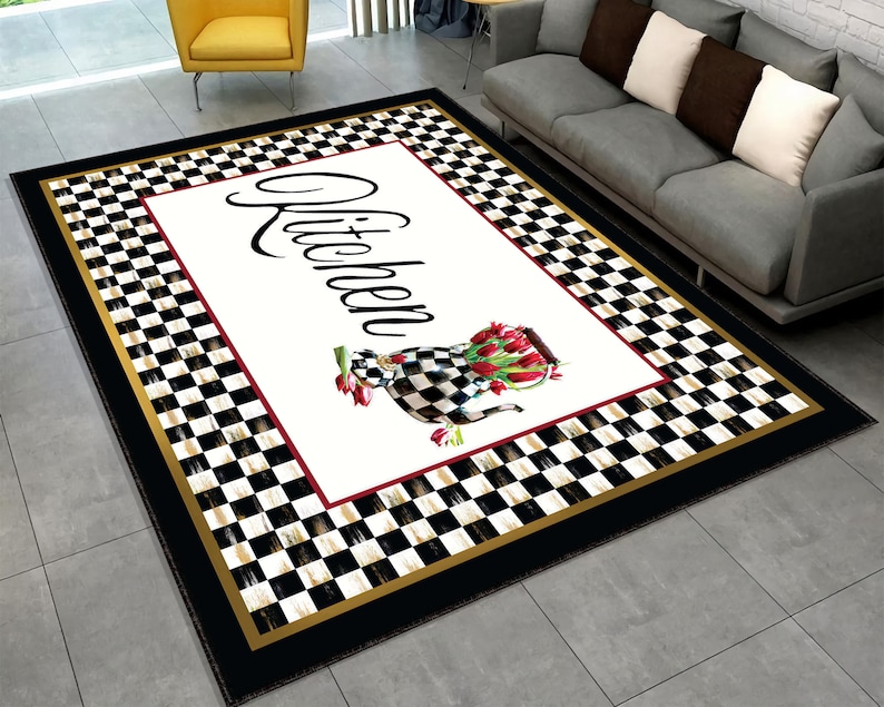 A black and white checkered kitchen rug with a gold border. The rug has a white center with the word "Kitchen" in black script and a watercolor illustration of a teapot with red tulips.