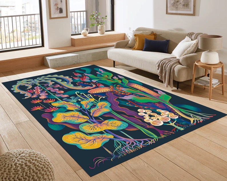 May include: A colorful rug with a dark blue background featuring a stylized floral design with yellow, green, purple, and red accents. The rug has a whimsical and abstract design.