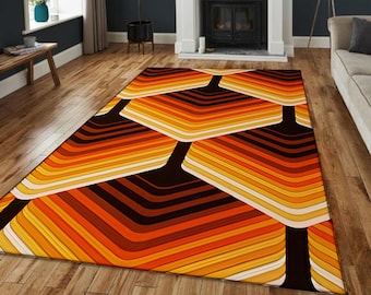 May include: A geometric patterned rug with orange, yellow, and brown stripes. The rug has a modern, retro design.