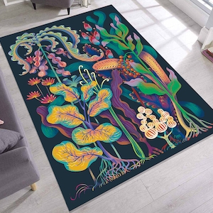 May include: A dark blue rug with a colorful floral design. The rug features a variety of flowers, leaves, and vines in shades of pink, purple, green, yellow, and orange. The rug has a whimsical and organic feel.