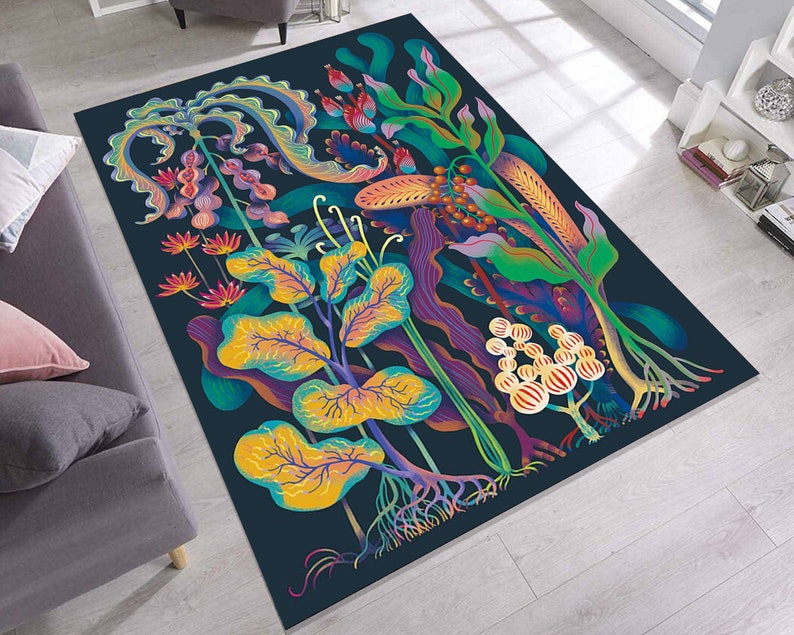May include: A dark blue rug with a colorful floral design. The rug features a variety of flowers, leaves, and vines in shades of pink, purple, green, yellow, and orange. The rug has a whimsical and organic feel.