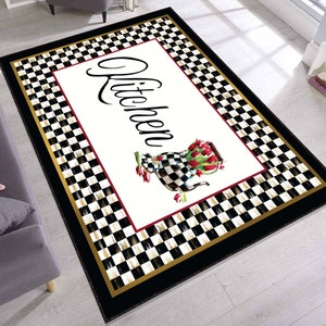 Black and white checkered kitchen rug with a gold border and the word "Kitchen" in a decorative script font. A white pitcher with red tulips is in the center of the rug.