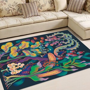 May include: A colorful rug with a dark blue background featuring a stylized floral design with yellow, green, blue, purple, and red flowers and leaves.