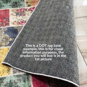 May include: A close-up of a colorful patchwork rug with a gray rug base underneath. The text "This is a DOT rug base example, this is for visual information purposes, the product you will buy is in the 1st picture" is visible on the gray rug base.