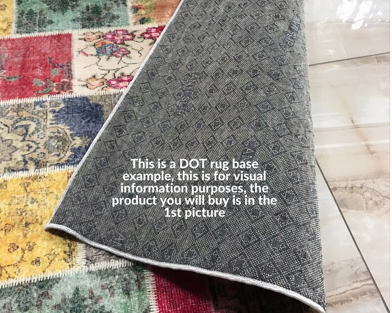 May include: A close-up of a colorful patchwork rug with a gray rug base underneath. The text "This is a DOT rug base example, this is for visual information purposes, the product you will buy is in the 1st picture" is visible on the gray rug base.