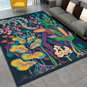 May include: A colorful rug with a floral design featuring vibrant green, yellow, purple, and red hues. The rug has a dark blue background and intricate details.