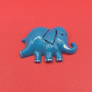 Vintage blue plastic elephant magnet