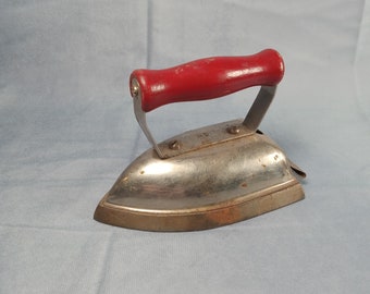 Lady Dover red handled small toy iron
