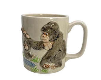 Taza vintage Otagiri Made In Japan con mono y bebé en relieve (nueva sin usar)