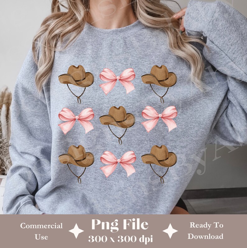May include: A grey sweatshirt with a repeating pattern of brown cowboy hats and pink bows. The text "Png File 300 x 300 dpi" is printed on the bottom of the sweatshirt.