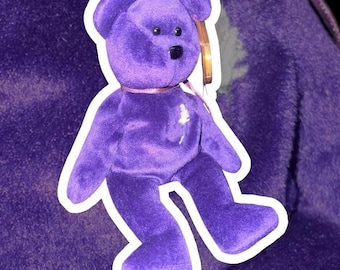 May include: A plush purple teddy bear with a white outline. The bear has a black nose and small black eyes. It has a pink ribbon around its neck and a tag attached to its ear. The bear is on a purple background.