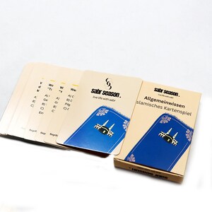 May include: A set of Islamic general knowledge playing cards with a blue background and a gold border. The cards feature a mosque and the text "sabr season. live life with sabr".