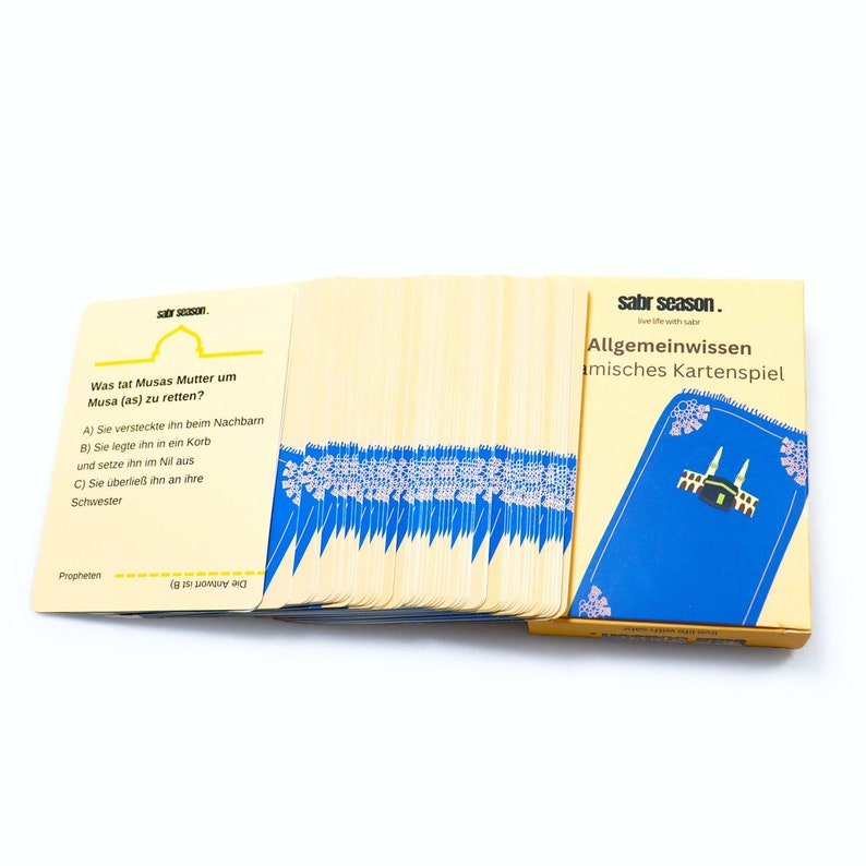 May include: A deck of Islamic trivia cards with a blue and yellow box. The box has the text "sabr season. live life with sabr" and "Allgemeinwissen islamisches Kartenspiel". The cards have questions about the prophet Musa (Moses) and his mother.