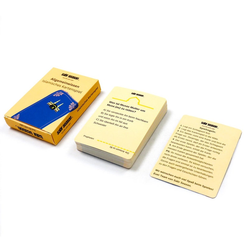 May include: A yellow card with the text "sabr season." and the title "Allgemeinwissen Islamisches Kartenspiel". The card features a blue and white image of a mosque.