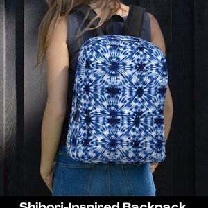 May include: A blue and white tie-dye backpack with a shibori-inspired pattern. The backpack has a zipper closure and adjustable straps.