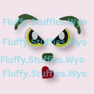 May include: Green felt eyebrows, yellow and black felt eyes, a green felt nose, and a red felt heart. These felt pieces are for crafting.