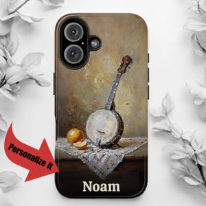 May include: A phone case with a painting of a banjo and fruit on a table. The case has a black background and the name "Noam" is printed on the bottom.