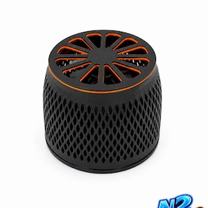 May include: A cylindrical black plastic filter guard with a diamond-patterned mesh exterior and a top circular grate featuring orange accents. The object has a solid base and a vented top, designed for aquarium use, with the N2 Reef logo visible.