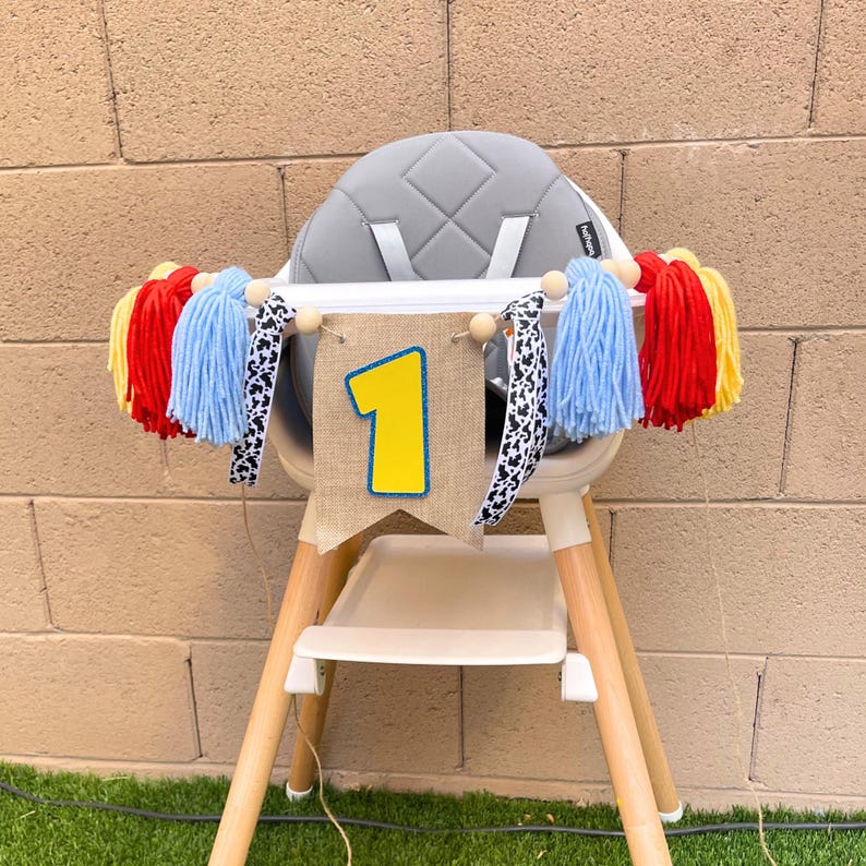 toy cartoon character 1st birthday high chair banner