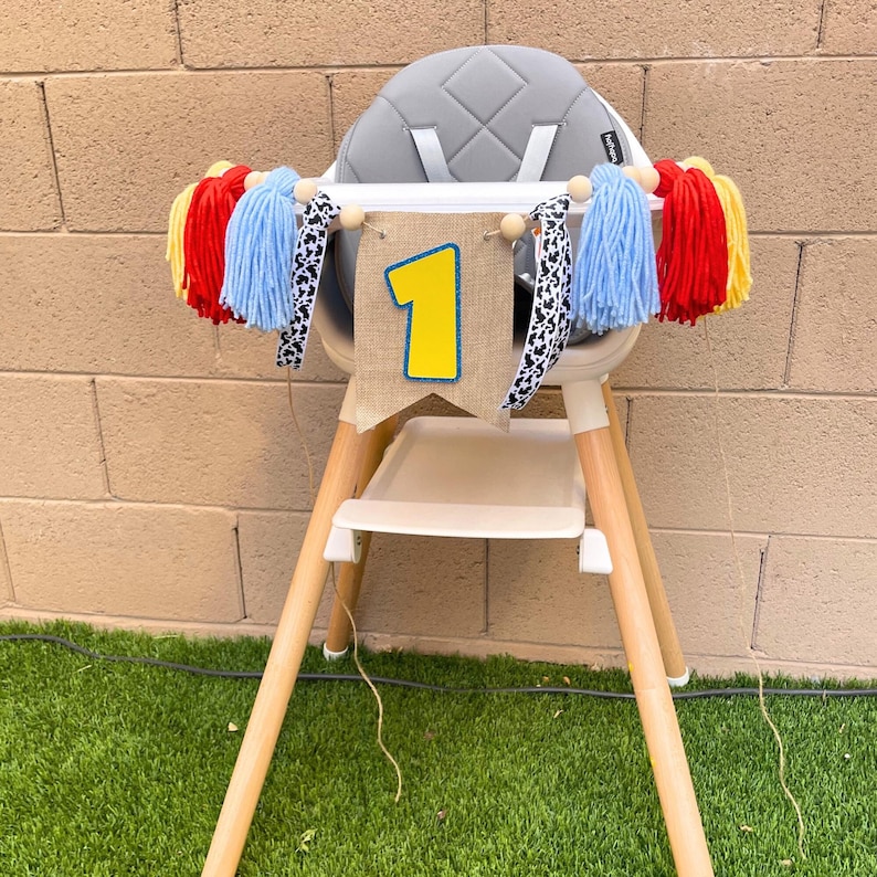 toy cartoon character 1st birthday high chair banner