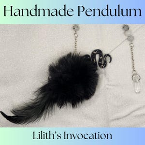 May include: Handmade pendulum with a black feather, a black pom-pom, and a black snake charm with gold accents. The charm has a crescent moon and stars. The pendulum is attached to a silver chain with clear crystal beads. The text "Lilith's Invocation" is visible at the bottom of the image.