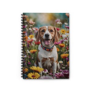May include: Spiral-bound notebook with a cheerful beagle dog amidst a vibrant flower field. The dog has brown and white markings, a floral collar, and is surrounded by yellow, orange, pink, and purple flowers. The notebook has a black spiral binding.