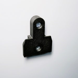 May include: Black plastic wall mount with two screw holes.