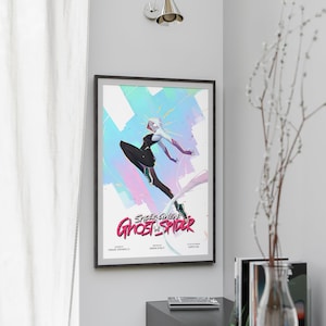 May include: A poster featuring Spider-Gwen, also known as Ghost-Spider, in a dynamic pose against a colorful background. The poster has a pink, blue, and white color scheme with a white outline around the image. The text "Spider-Gwen Ghost-Spider" is written in pink and white letters at the bottom of the poster.