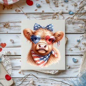 May include: A brown and white Highland cow with a red, white, and blue bandana and heart-shaped sunglasses. The cow is wearing a bow with white stars on it.