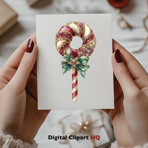 May include: A red and white candy cane with a gold and green holly sprig and a red bow. The candy cane is decorated with gold glitter and red jewels.