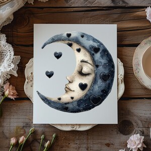 May include: A watercolor painting of a crescent moon with a sleeping face. The moon is decorated with black hearts and has a dark blue and gray color scheme.